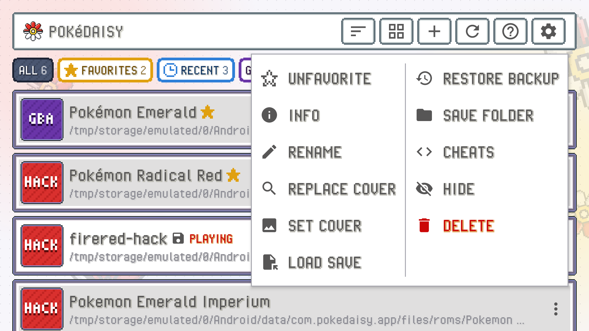 A game's menu open over the library: UNFAVORITE, INFO, RENAME, REPLACE COVER, SET COVER, LOAD SAVE, RESTORE BACKUP, SAVE FOLDER, CHEATS, HIDE and DELETE